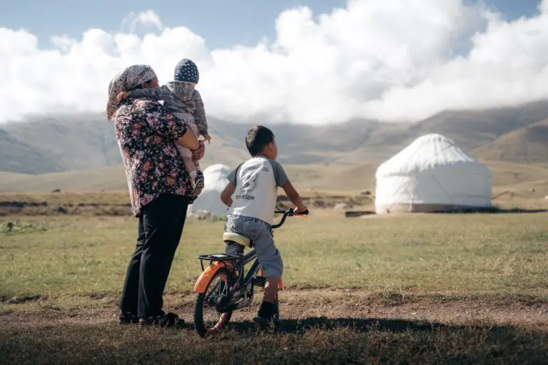 Family in front of their yurt in Song Kul