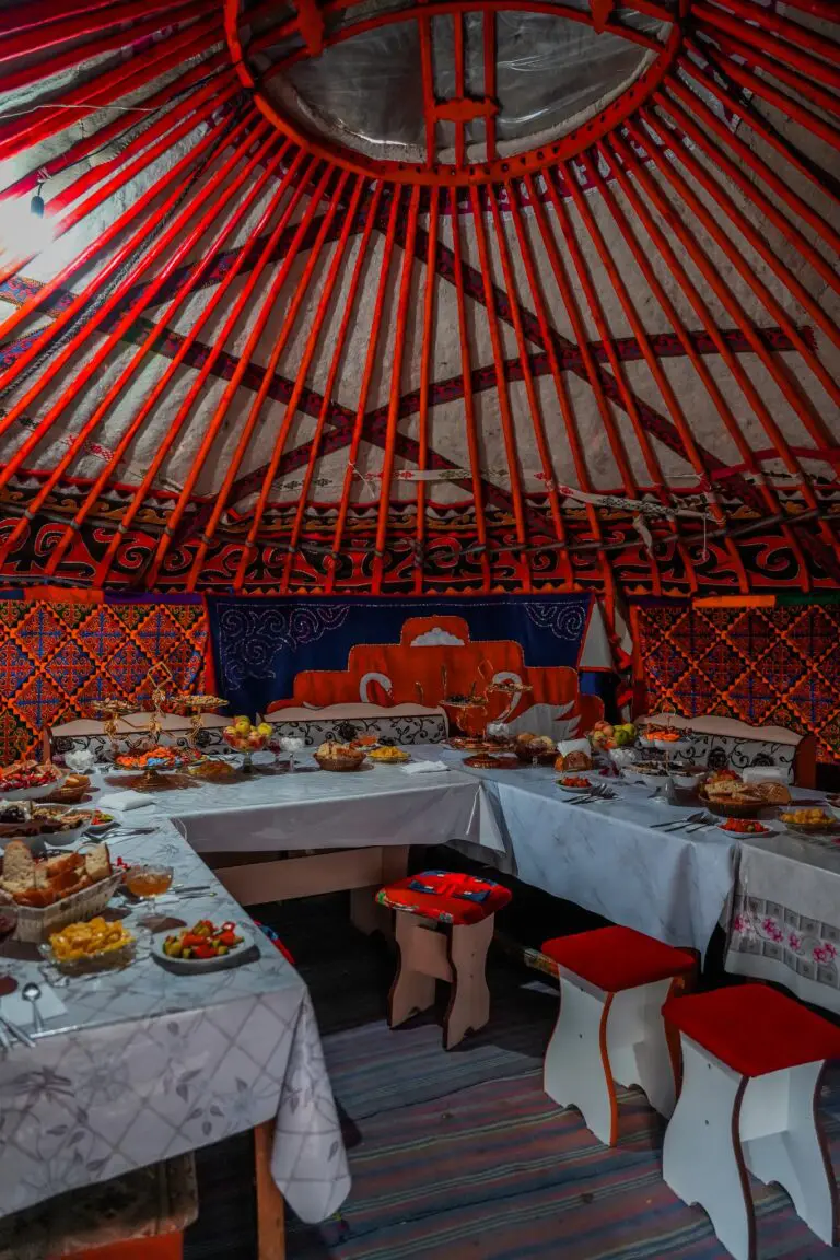traditional yurt interior with tables laden with food