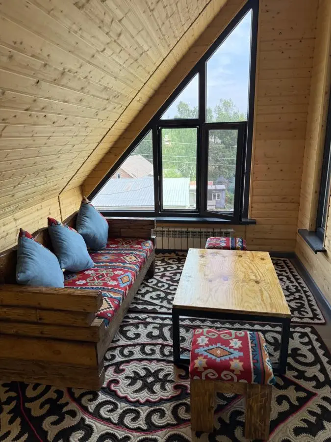 cozy guesthouse interior with traditional patterns and wooden walls