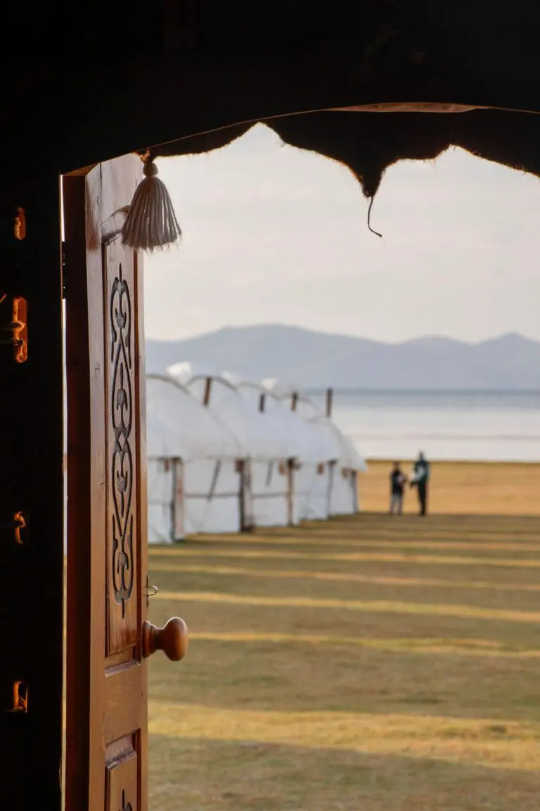 view from yurt door to camp and lake in Kyrgyzstan